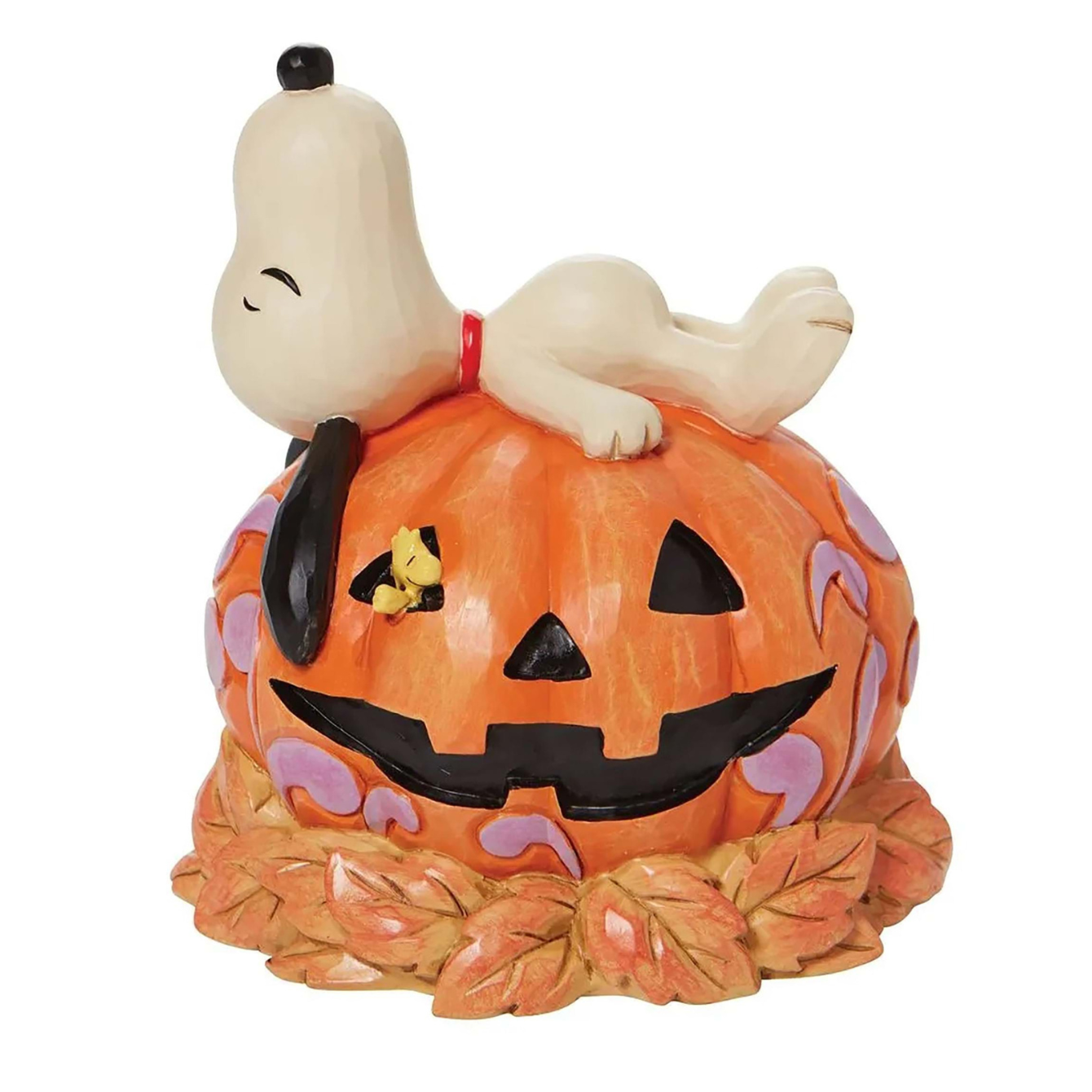 Snoopy Laying on Top of Carved Pumpkin